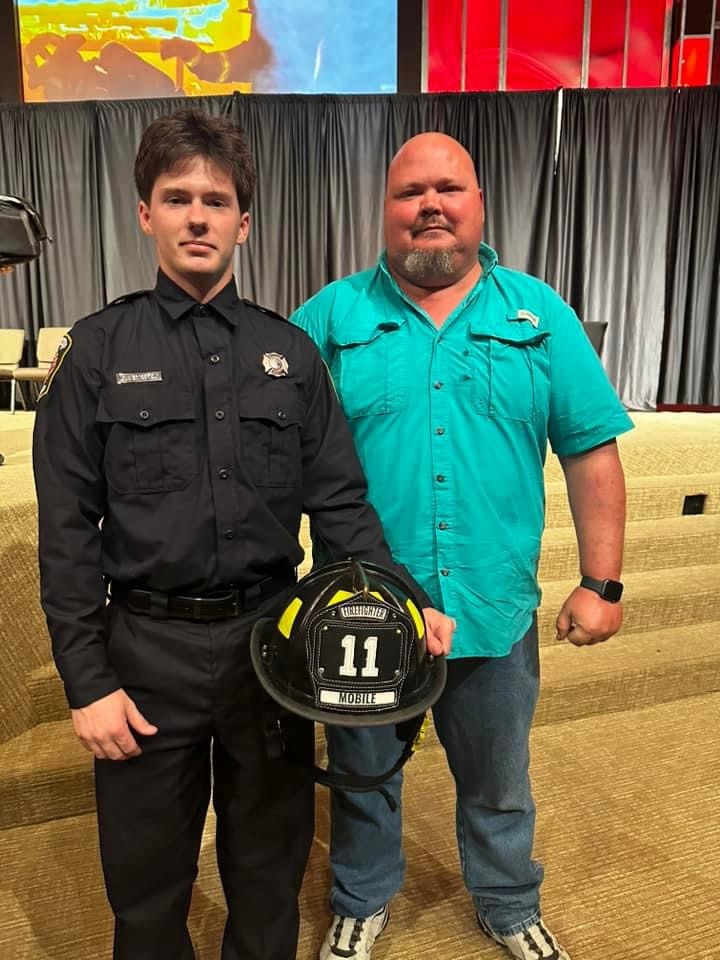 Ian Westerfield with his stepfather at graduation