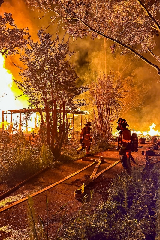 Firefighters at fully-involved house fire